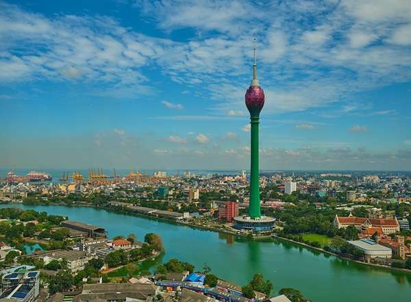Distant view of Lotus Tower with Colombo skyline – Explore Colombo's iconic landmarks -day tours to Colombo