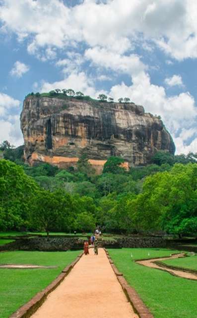 Ancient rock fortress of Sigiriya surrounded by lush greenery