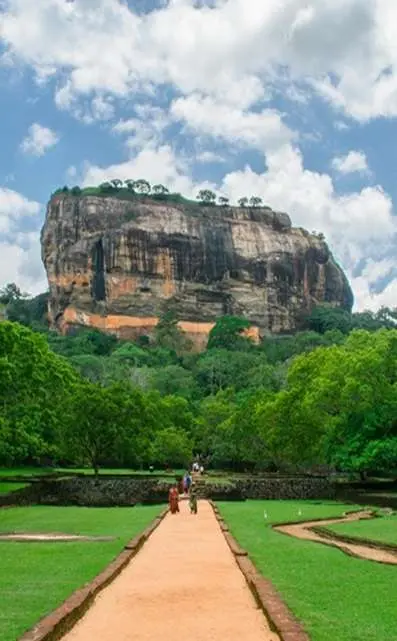 Ancient rock fortress of Sigiriya surrounded by lush greenery