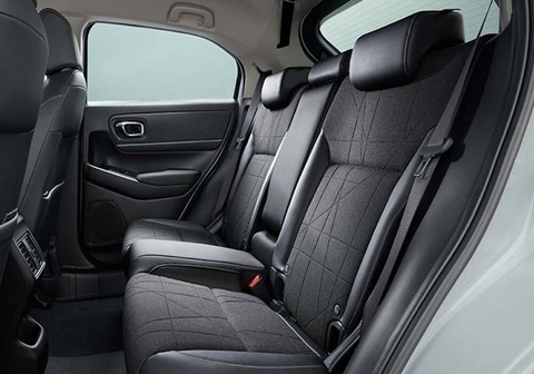 Rear passenger seating in an SUV with ample legroom and comfortable cushions.