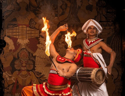 Drummer and fire walker performing during Kandy Cultural Dance Show