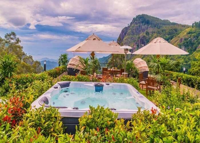 Outdoor jacuzzi at EKHO Ella Hotel with stunning hill country view in Sri Lanka