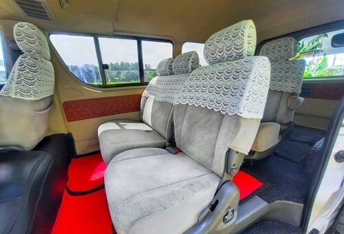 Inside seats of KDH flat roof van with spacious arrangement.