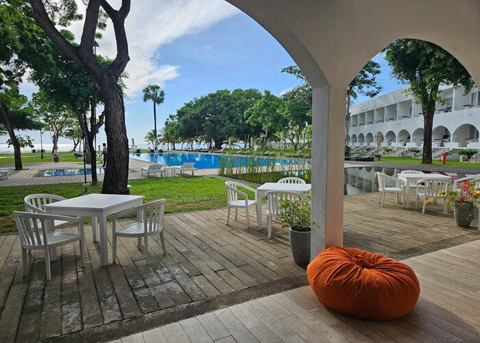 Trinco Blu by Cinnamon hotel garden view with pool and sea in Trincomalee Sri Lanka