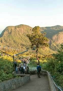 People walking along the trekking path to Adam’s Peak Sri Lanka in Nallathanniya