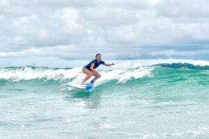 man surfing in Weligama near Mirissa Sri Lanka