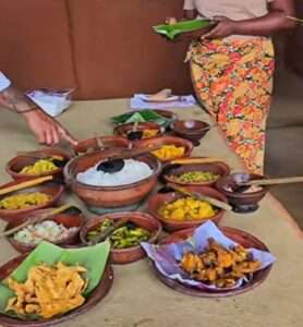 Visitors learning to prepare traditional Sri Lankan dishes during a Sigiriya village cooking experience in Hiriwadunna.